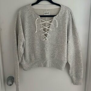 Cropped lace up sweatshirt
